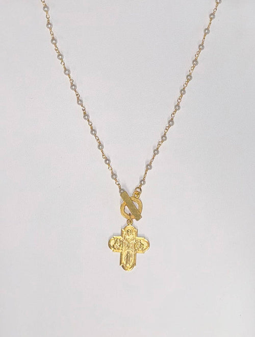Gold cross necklace with engraved design