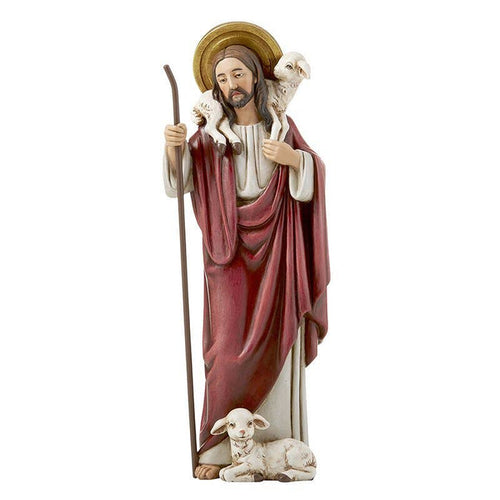 Shepherd Jesus with lamb at feet and carrying lamb with white background