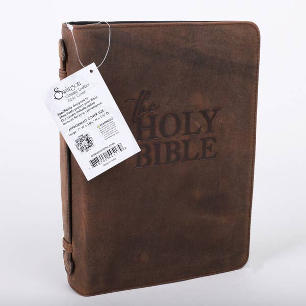 Brown leather Bible cover on white background with tag