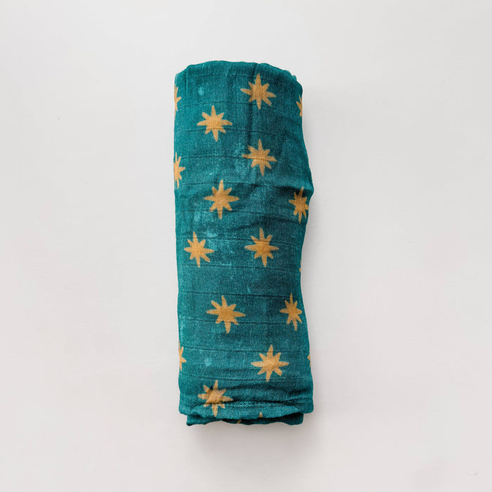 Rolled-up fabric with star patterns on a white background