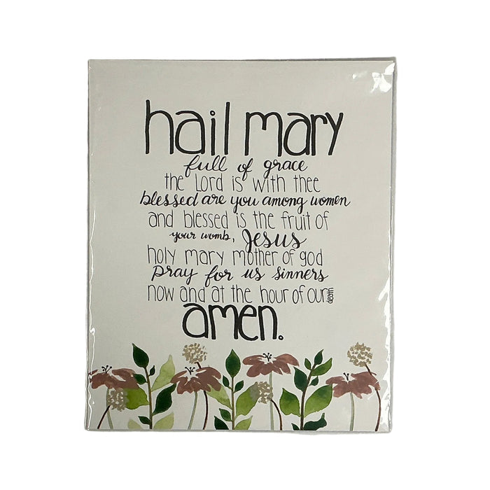 White with printed design on a gray surface