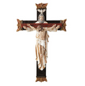 Decorative cross with Jesus Christ figure on a white background