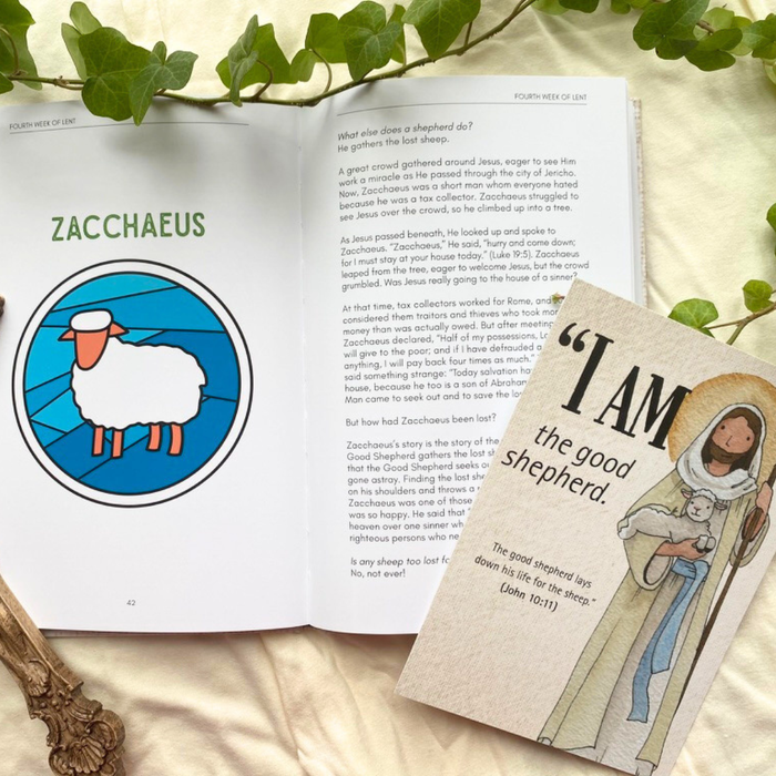 Open book with illustrations and text, including a book with a religious illustration and quote.