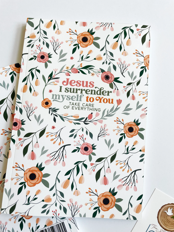 Floral notebook with text on a white background