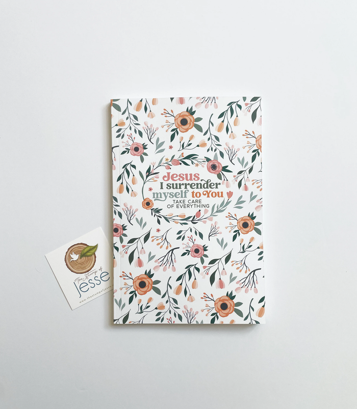 Floral notebook with inspirational quote on a white background