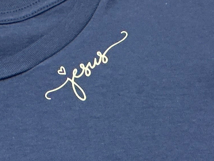 Navy blue shirt with “Jesus” written on it