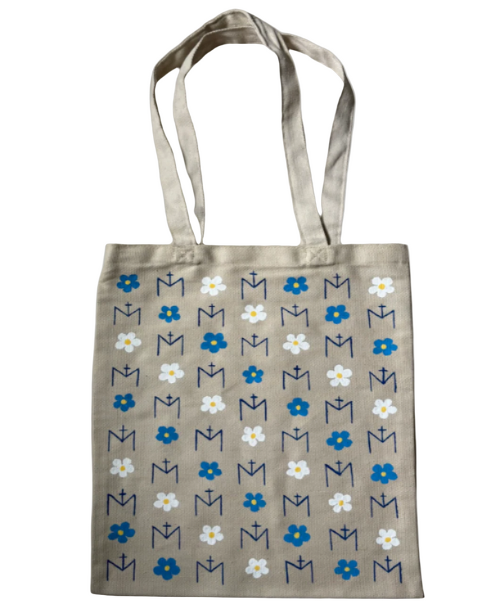 Tote bag with floral and letter pattern on a beige background