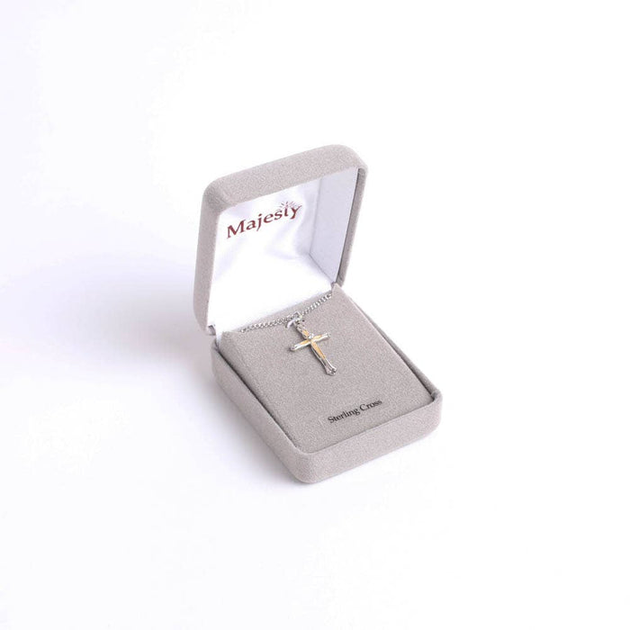 Silver cross necklace in a 'Majesty' jewelry box on a white background