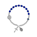 Bracelet with blue beads and silver charms on a white background
