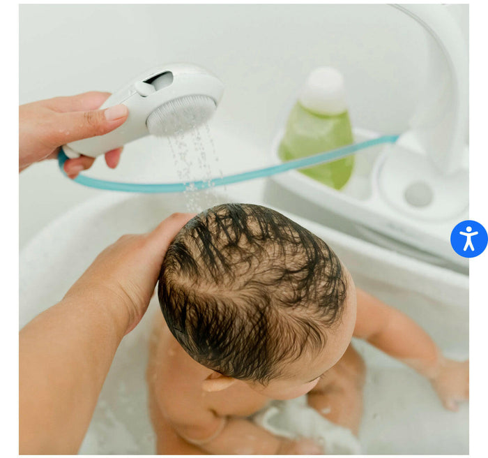 The First Years Rain Shower Baby Spa with Soothing Spray Showerhead.