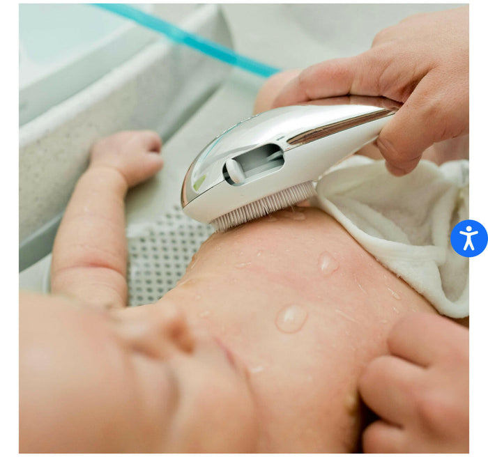 The First Years Rain Shower Baby Spa with Soothing Spray Showerhead.