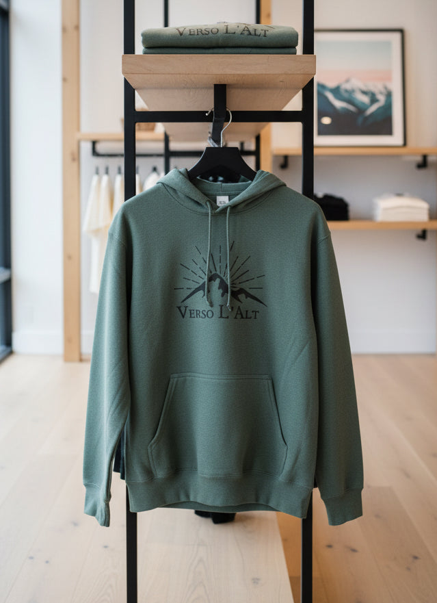 Green hoodie with 'Verso L'Alt' logo on a mannequin against a fabric background