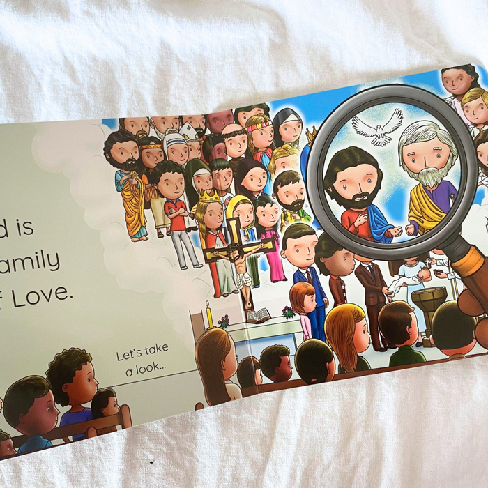 Illustrated book with cartoon characters and a magnifying glass on a white fabric background