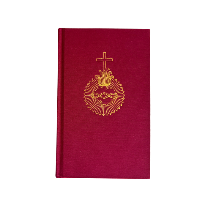 Red book with gold emblem and cross on a white background